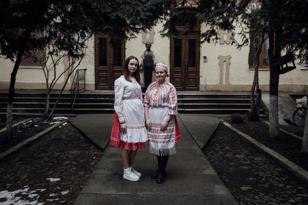 Two women in traditional Hungarian dress in Berehove, Ukraine, January 26, 2024.