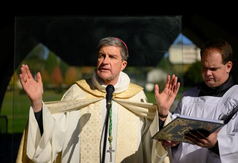 Eric de Moulins-Beaufort, archbishop of Reims and President of the Conference des Eveques de France (CEF-French Bishops' Conference) leads a prayer on the last day of the plenary assembly of the bishops of France, in Lourdes, southwestern France, on November 8, 2023. (Photo by Lionel BONAVENTURE / AFP)