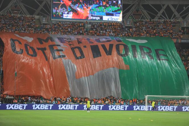 Côte d’Ivoire supporters hold a giant banner ahead of the Africa Cup of Nations (AFCON) 2024 final at Alassane Ouattara Olympic Stadium in Ebimpe, Abidjan on February 11, 2024. 
