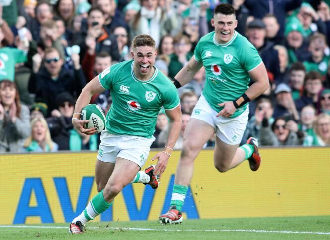 Fly-half Jack Crowley (ball in hand) prepares to score a try during his team's victory against Italy on February 11, 2024 at the Aviva Stadium, Dublin.