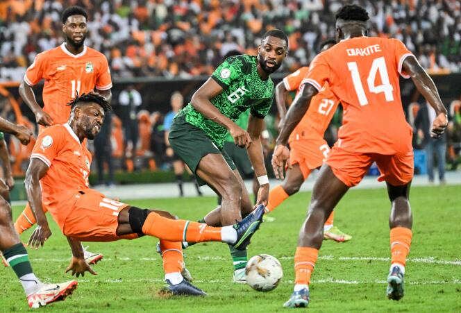 Nigeria's Semi Ajayi (C) fights for the ball withCôte d’Ivoire's Ibrahim Sangare (L) during the Africa Cup of Nations (AFCON) 2024 final at Alassane Ouattara Olympic Stadium in Abidjan on February 11, 2024.