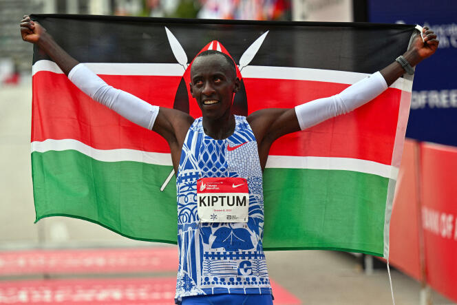 Kenyan Kelvin Kiptum celebrates his new record at the Chicago Marathon on October 3, 2023.