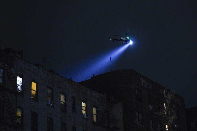 An NYPD helicopter patrols the area after a shooting at the Mount Eden Avenue subway station on February 12, 2024.