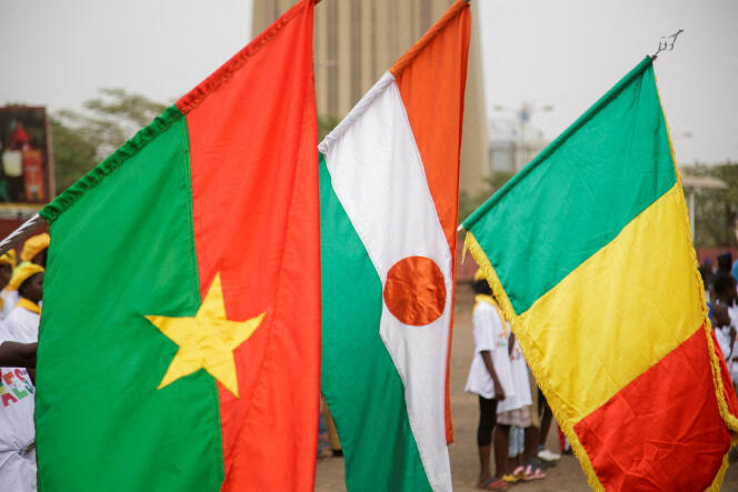 Flags of Burkina Faso, Niger and Mali during a demonstration called by the Malian regime to support their decision to leave ECOWAS in Bamako on February 1, 2024.