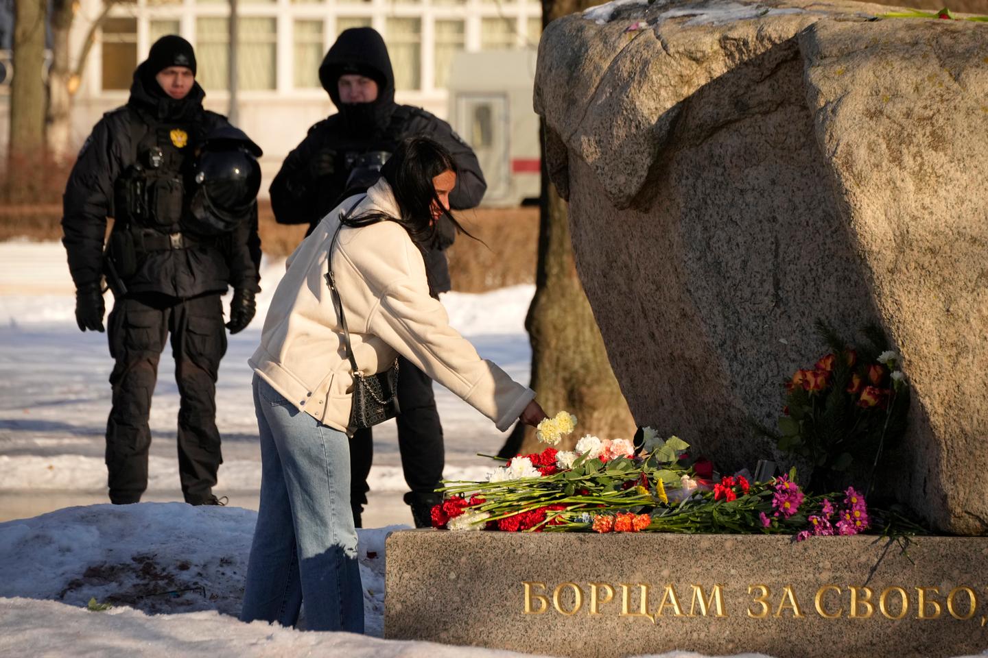 Russian courts impose jail sentences to dozens of Navalny mourners