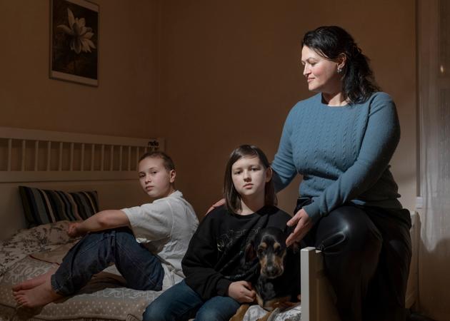 Iryna Kravchenko, 40, and her sons Yaroslav, 12 (left), and Timur, 10 (center), fled the war in Ukraine to their new home in Berlin, Germany, on February 13, 2024.