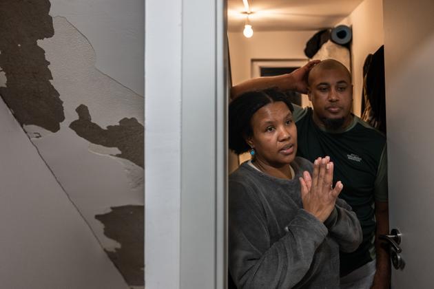 Maria and Manuel Da Luz, aged 45 and 43, open the door to their apartment in the attic of a house divided into several dwellings, in Audun-le-Tiche, France, on February 5, 2024.