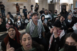 CHICAGO, ILLINOIS - JANUARY 31: Pro-Palestine demonstrators rally in the lobby of City Hall while the City Council debates a symbolic resolution calling for a cease-fire in the war between Israel and Hamas on January 31, 2024 in Chicago, Illinois. The resolution passed by a vote of 24 to 23 after Mayor Brandon Johnson cast the tie-breaking vote. Scott Olson/Getty Images/AFP (Photo by SCOTT OLSON / GETTY IMAGES NORTH AMERICA / Getty Images via AFP)