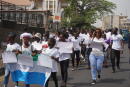 Anti Female Genital Mutilation(FGM) campaigners march to end FGM in Sierra Leone on International Women’s Day in Freetown on March 8, 2022. (Photo by Saidu BAH / AFP)