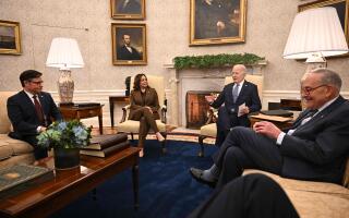 US President Joe Biden (2nd R) and Vice President Kamala Harris (2nd L) meet with House Speaker Mike Johnson (L), Senate Majority Leader Chuck Schumer (R) at the Oval Office of the White House in Washington, DC on February 27, 2024. Biden is meeting with the congressional leaders in a bid to unlock billions of dollars in stalled emergency aid to Ukraine and avert a looming government shutdown at home. (Photo by Jim WATSON / AFP)