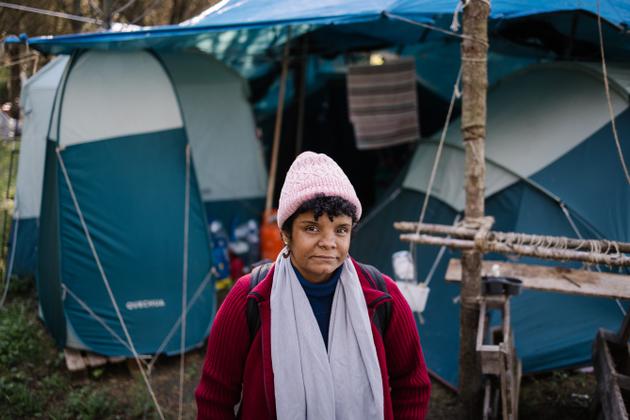 Andreia Costa, a 49-year-old Brazilian cleaner and carpenter, in front of her camp at Quinta dos Ingleses, in Carcavelos, near Lisbon, on February 28.