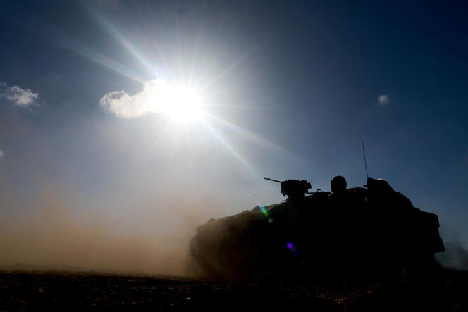 March 4, 2024, an armored personnel carrier maneuvers near the border between Israel and the Gaza Strip.