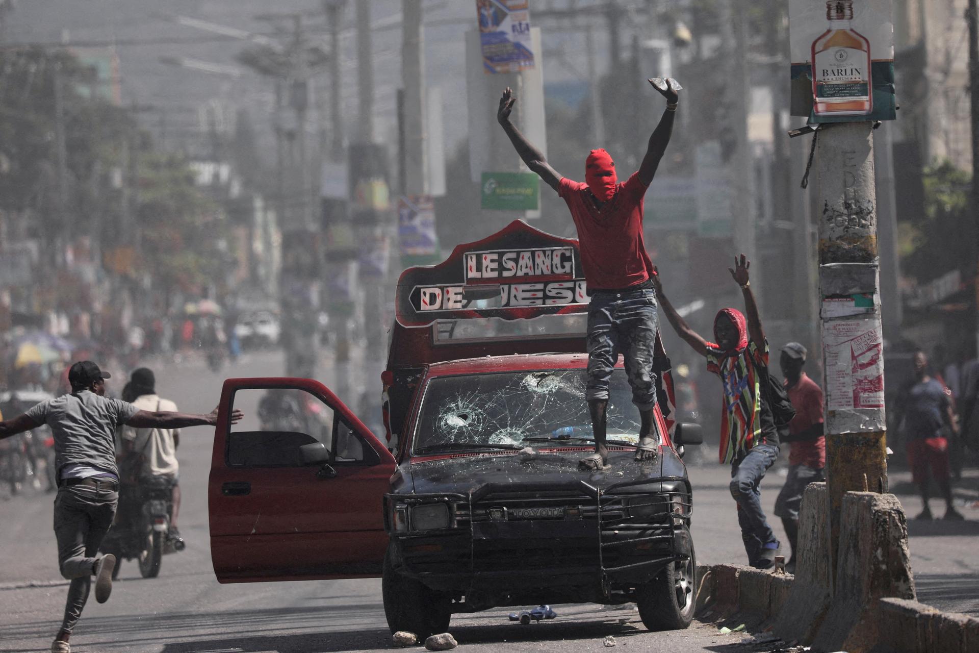 A man with his face covered, at a demonstration calling for the resignation of Haiti's Prime Minister Ariel Henry, in Port-au-Prince, March 1, 2024.