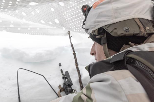 A soldier from the Seventh Bataillon of Alpine Hunters (BCA) in his camouflaged firing position near Masi, Norway, on March 6, 2024.