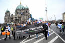 People carry a banner as they attend a demonstration under the heading "Together against left-wing, right-wing and Islamist anti-semitism - Solidarity with Israel", amid the ongoing conflict between Israel and the Palestinian group Hamas, in Berlin, Germany, March 10, 2024. REUTERS/Annegret Hilse