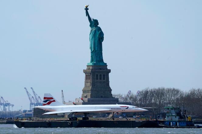 The Intrepid Museum’s iconic British Airways Concorde G-BOAD supersonic jet passes by the Statue of Liberty, in New York on March 13, 2024, as it makes its way to Weeks Marine in Jersey City, New Jersey for storage overnight.