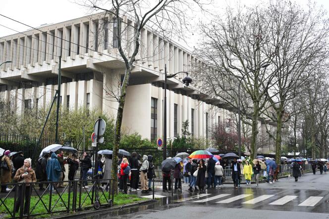 Voters queue in front of the Russian Embassy in France during the Russian presidential election on March 17, 2024, in Paris.