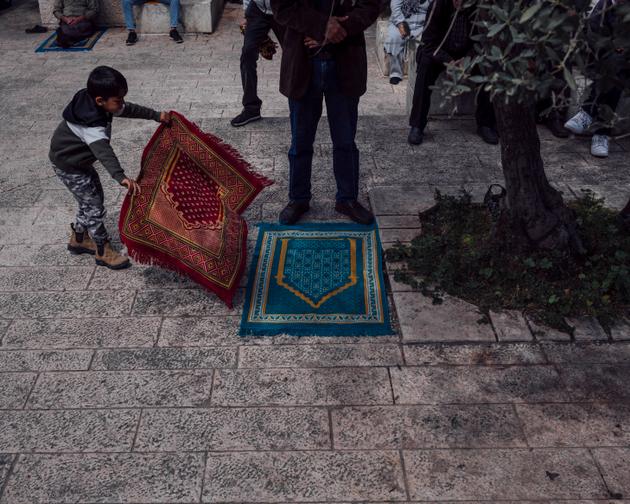 Palestinians pray outside Al-Aqsa Mosque, Jerusalem, March 15, 2024.