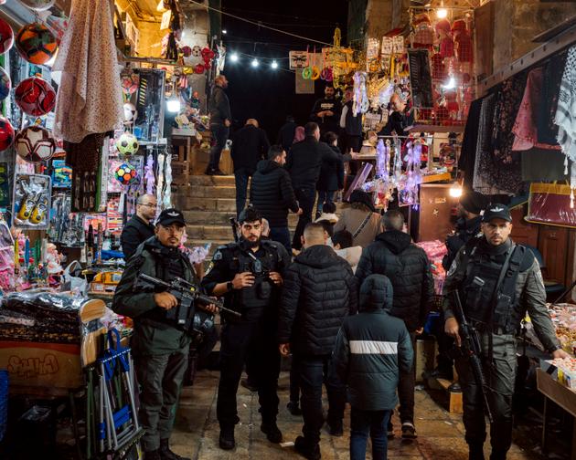 During the prayer marking the breaking of the fast on the first day of Ramadan, Israeli policemen filter entrances at the Cotton Gate (Bab al-Qattanin) to the Al-Aqsa Mosque in East Jerusalem, March 11, 2024.