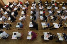 High school students take the philosophy exam, the first test session of the 2019 baccalaureate (high school graduation exam) on June 17, 2019 at the Pasteur high school in Strasbourg, eastern France. (Photo by FREDERICK FLORIN / AFP)