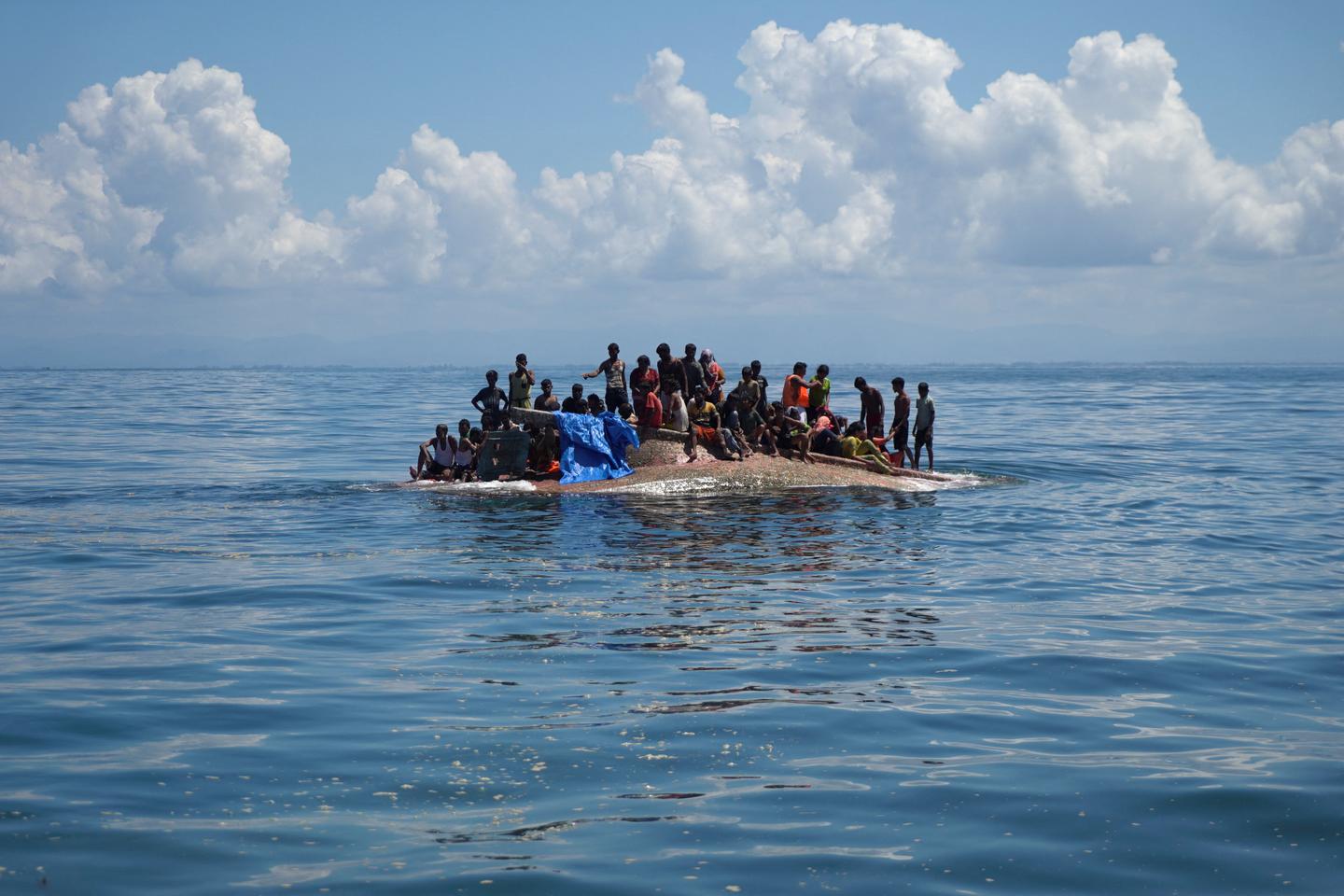 Indonesian rescuers save 69 Rohingya refugees after boat capsizes
