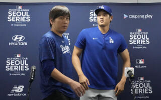 Los Angeles Dodgers' Shohei Ohtani, right, and his interpreter, Ippei Mizuhara, leave after at a news conference ahead of a baseball workout at Gocheok Sky Dome in Seoul, South Korea, Saturday, March 16, 2024. Ohtani’s interpreter and close friend has been fired by the Dodgers following allegations of illegal gambling and theft from the Japanese baseball star. (AP Photo/Lee Jin-man)