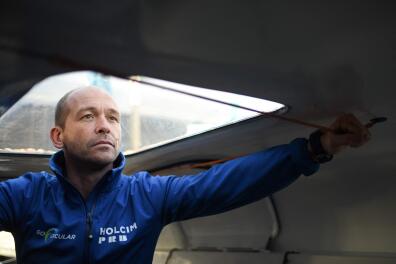 (FILES) French skipper Kevin Escoffier poses for a picture aboard is Imoca monohull Holcim-PRB in Saint-Malo, the starting point of the Route du Rhum solo sailing race, in Saint-Malo on November 3, 2022. On March 22, 2024, the French Sailing Federation overturned the sanction imposed on skipper Kevin Escoffier, who was suspended following accusations of sexual violence, due to a "procedural flaw" raised by a conciliator from the French National Olympic and Sports Committee (CNSOF), it announced in a press release. (Photo by Sebastien SALOM-GOMIS / AFP)