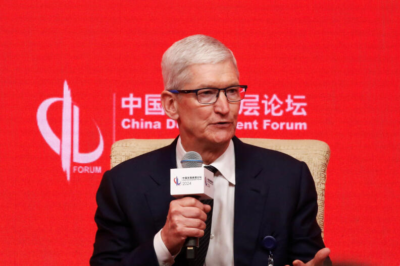 Apple CEO Tim Cook speaks at the China Development Forum (CDF) 2024, in Beijing, China March 24, 2024. REUTERS/Jing Xu