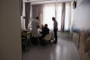 Doctor Yves de Locht and Wim Diestelmans, Professor in palliative care, arrive in a hospital room for the euthanasia of Lydie Imhoff at a hospital in Belgium, on February 1, 2024. Lydie Imhoff, a 43 year-old French citizen suffering from hemiplegia and blindness from birth due to a perinatal stroke, has been authorized to travel from Besancon, France, to Belgium to undergo euthanasia on February 1, 2024. (Photo by Simon Wohlfahrt / AFP) / SOLELY TO ILLUSTRATE THE EVENT AS SPECIFIED IN THE CAPTION – ANY USE IN ANOTHER CONTEXT WILL ENTAIL LIABILITY ON YOUR PART