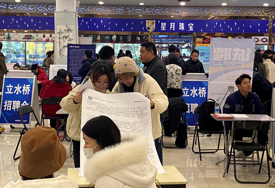 FILE PHOTO: People attend a job fair following the Lunar New Year holiday, in Beijing, China, February 23, 2024. REUTERS/Ellen Zhang/File Photo