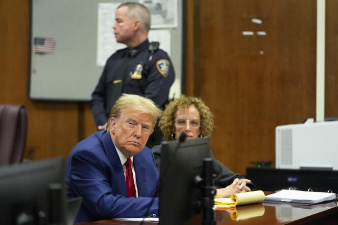 Former President Donald Trump awaits the start of a pre-trial hearing with his defense team at a Manhattan courtroom, Monday, March 25, 2024, in New York. 