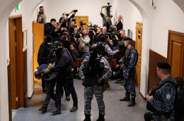 Saidakrami Murodali Rachabalizoda, a suspect in the shooting attack at the Crocus City Hall concert venue, is escorted after a court hearing at the Basmanny district court in Moscow, Russia March 24, 2024. REUTERS/Shamil Zhumatov