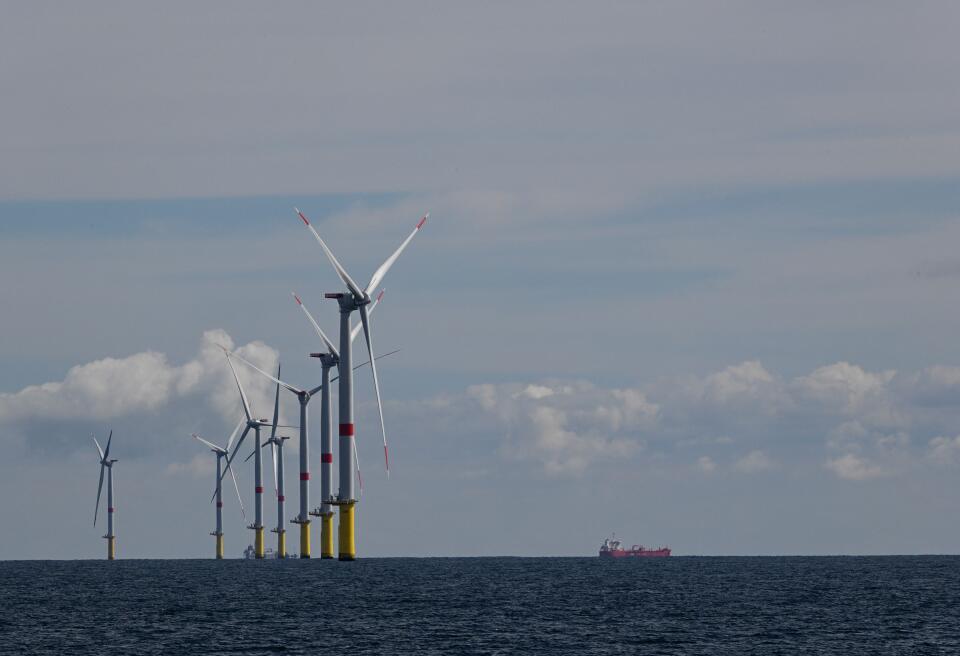 Wind turbines are pictured on the first French offshore wind farm off the coasts of La Turballe, western France on September 30, 2022. The wind farm, consisting of 80 wind turbines, will supply 480MW, with an investment of 2 billion euros (Photo by Damien MEYER / AFP)