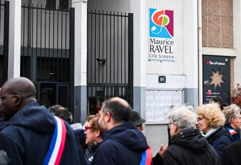 Elected officials stand during a gathering organised by French socialist party, in front of the Ravel highschool (lycee Ravel), in Paris, on March 29, 2024, following the resignation of the highschool headmaster. Three days after the announcement of the departure of the principal of a Paris high school who had been threatened with death after an altercation with a pupil demanding that she remove her headscarf, a rally is scheduled for on March 29, 2024 in front of the school complex, before the headmasters, "on the front line", take the floor. (Photo by Bertrand GUAY / AFP)