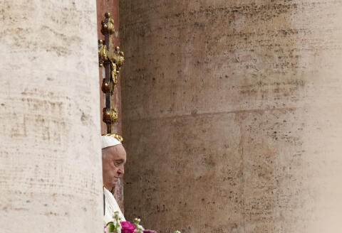 Pope Francis waves faithful from the central lodge of the St. Peter's Basilica prior to the the 'Urbi et Orbi' (To the city and to the world) blessing, at the Vatican, Sunday, March 31, 2024. (AP Photo/Alessandra Tarantino)