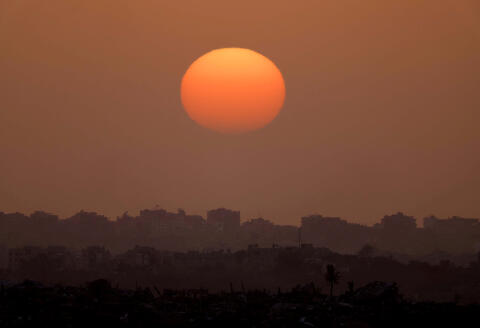 The sun sets over Gaza, amid the ongoing conflict between Israel and the Palestinian Islamist group Hamas, as seen from the border with Gaza in southern Israel, April 1, 2024. REUTERS/Hannah McKay TPX IMAGES OF THE DAY