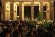 Marijuana smokers in front of the Brandenburg Gate during the 'Smoke-In' event in Berlin, Germany, Monday, April 1, 2024.
