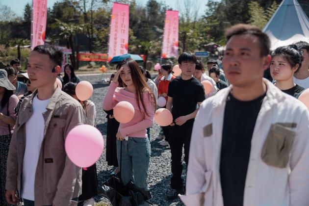 Participants at a speed dating event organized by the Chinese Communist Party listen to the organizers' welcome speech in Huzhou, China, on March 30, 2024.