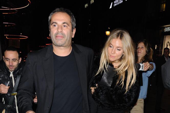 Businessman Jean-Yves Le Four and actress Sienna Miller in Paris, November 24, 2011.