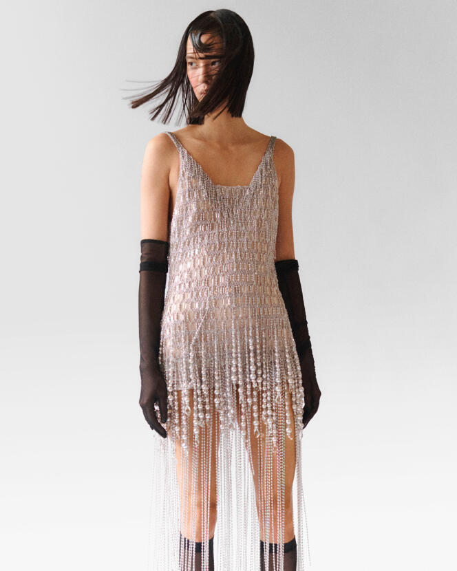 Beaded dress, silk net, pearls and glitter, price on request, Givenchy gloves.