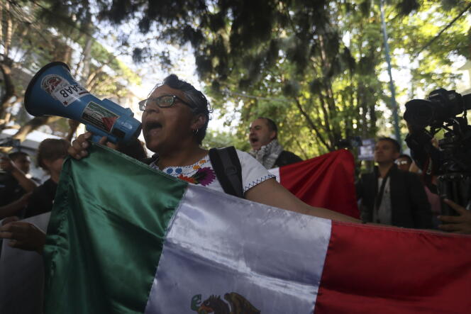 People protest outside the Ecuadorian Embassy in Mexico City, Mexico,  on April 6, 2024.