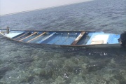 A capsized boat is seen near the coastal town of Obock, in northeastern Djibouti on April 9, 2024.