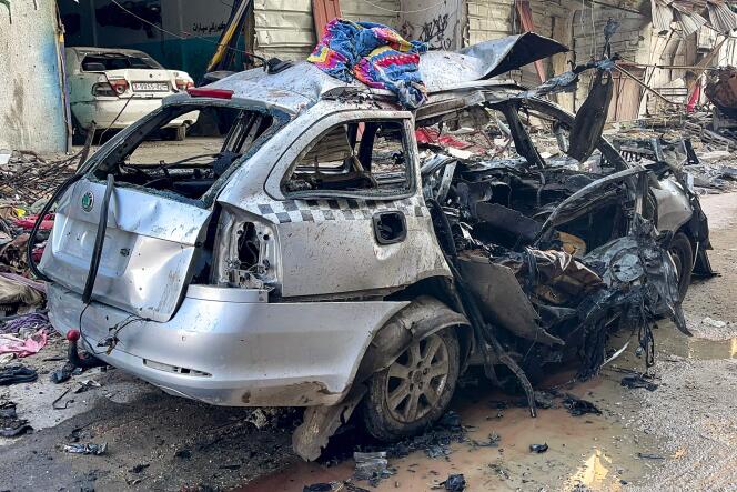 The car in which three sons of Hamas leader Ismail Haniyeh were reportedly killed in an Israeli air strike is pictured in Al-Shati camp, west of Gaza City, on April 10, 2024.