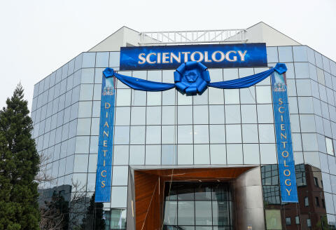 The facade of the new headquarters of the Church of Scientology is decorated, ahead of its inauguration in Saint-Denis, north of Paris, on April 6, 2024. The Church of Scientology, which has been classified as a cult in France by several parliamentary reports, is to inaugurate a new training centre on the outskirts of Paris in Saint-Denis. (Photo by Emmanuel Dunand / AFP)