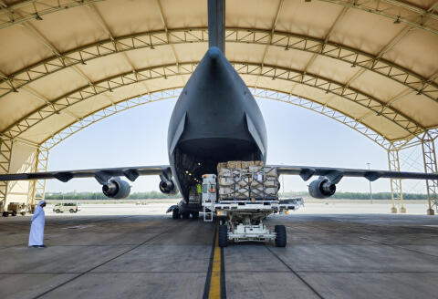 Workers load aid supplies into a military plane bound for Port Sudan at the Abu Dhabi International Airport in Abu Dhabi on May 10, 2023. The war between Sudan’s generals is having increasingly severe consequences for civilians, with a doubling over the past week of the number uprooted from their homes, the United Nations said. (Photo by Mohamad Ali Harissi / AFP)