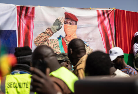 A banner of the Burkina Faso President Captain Ibrahim Traore is seen during a protest to support him and to demand the departure of France's ambassador and military forces, in Ouagadougou, on January 20, 2023. (Photo by OLYMPIA DE MAISMONT / AFP)