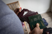 Bassam (not his real name) shows his family their French passports after leaving Gaza. March 29, 2024, in southeastern France.