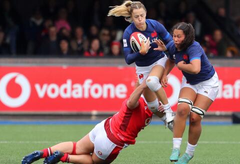 Wales' prop Gwenllian Prys (L) tackles France's wing Joanna Grisez during the Six Nations international women's rugby union match between Wales and France at Cardiff Arms Park in Cardiff, south Wales on April 21, 2024. (Photo by Geoff Caddick / AFP)