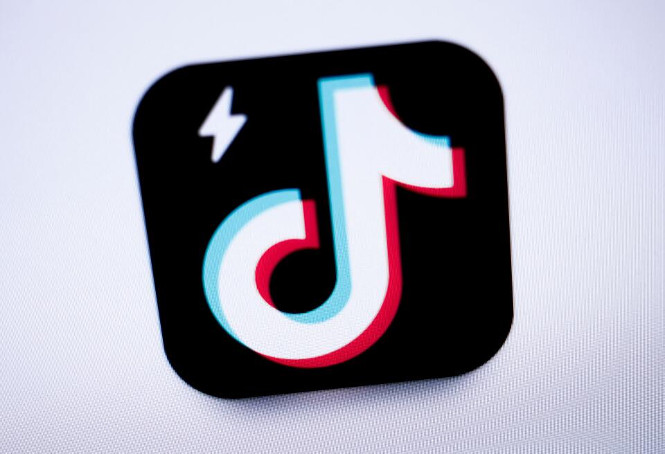 (FILES) This photograph taken on April 11, 2024, in Paris, shows the logo of the Chinese social network application TikTok Lite. The EU launched a probe into TikTok's spinoff Lite app and threatened to suspend an "addictive" feature on it rewarding users for watching and liking videos, amid child-safety concerns, a European Commission official told AFP. The European Commission has concerns about the "risks of serious damage for the mental health of users", including minors, from the rewards programme, the official said. TikTok Lite arrived in France and Spain in March. (Photo by Kiran RIDLEY / AFP)