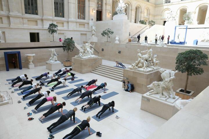 Dancers take part in a rehearsal of "Les visites sportives" by artist and choreographer Mehdi Kerkouche in the Cour Marly at the Louvre Museum in Paris on April 23, 2024. (Photo by Thomas SAMSON / AFP)